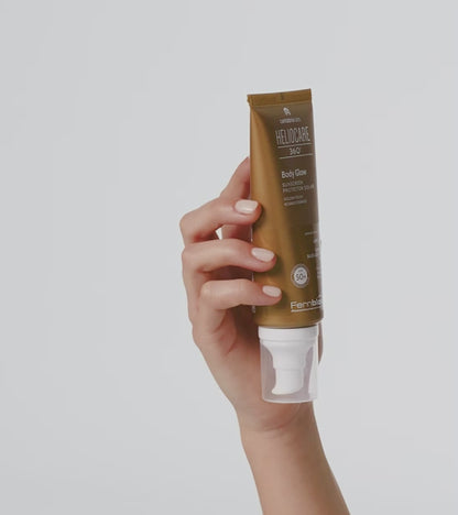 Heliocare 360° Body Glow SPF 50+ saules aizsargkrems ķermenim ar brodzas efektu uz balta fona